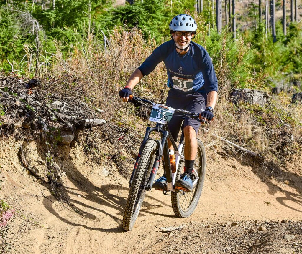The author mountain biking on the first leg of the race