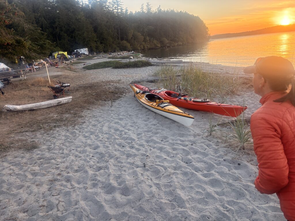 sandy beach with kayaks